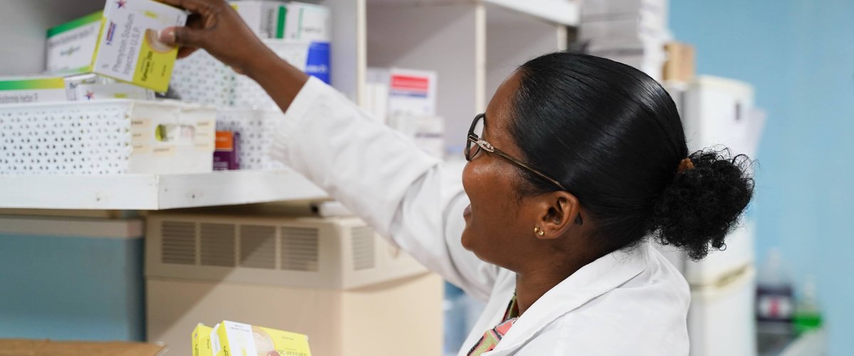 A Doctor in a clinic, looking for equipment
