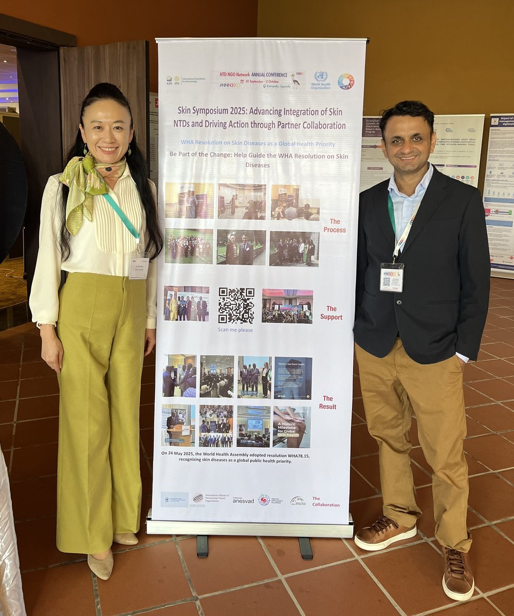 Dr Rie Yotsu and Dr Niraj Parajuli with a poster highlighting the road to the successful adoption of the WHA resolution and future directions displayed at the symposium